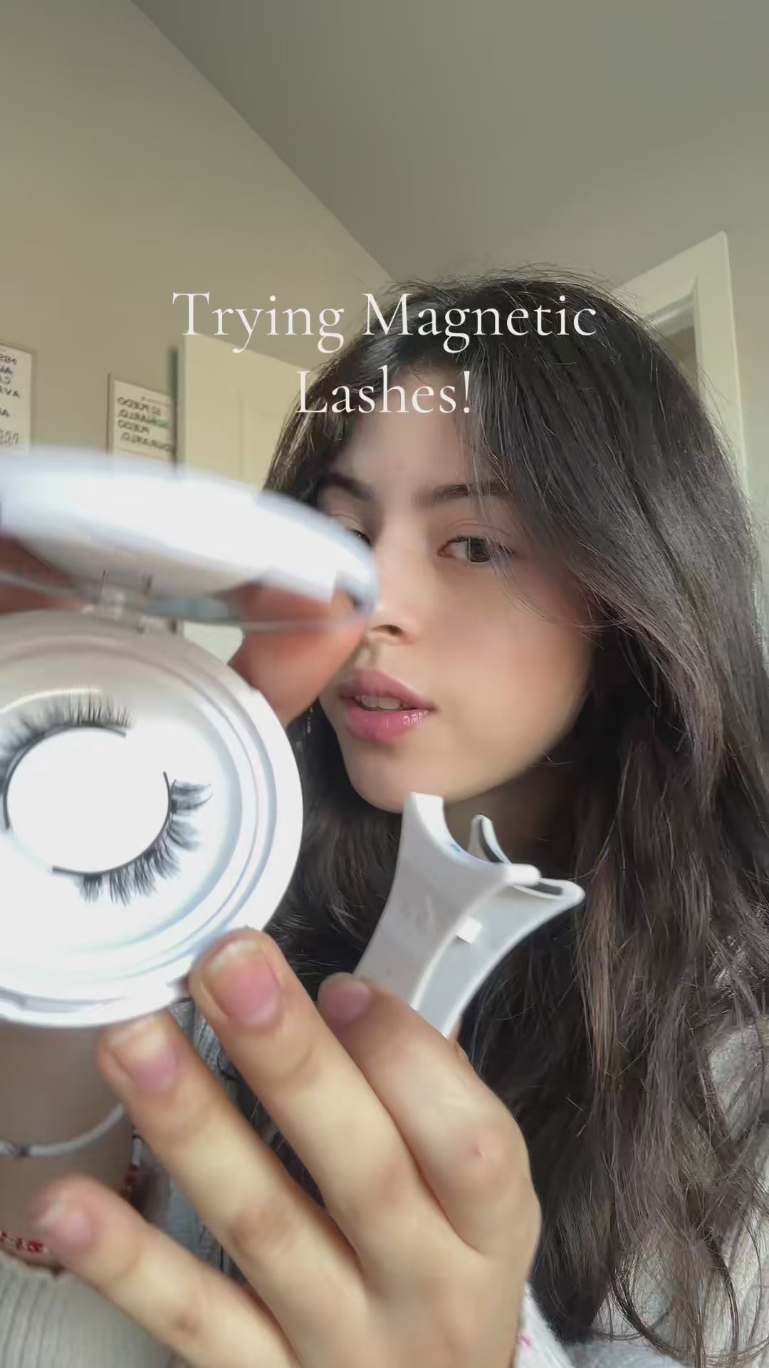 Load video: customer trying on magnetic lashes by applying with applicator
